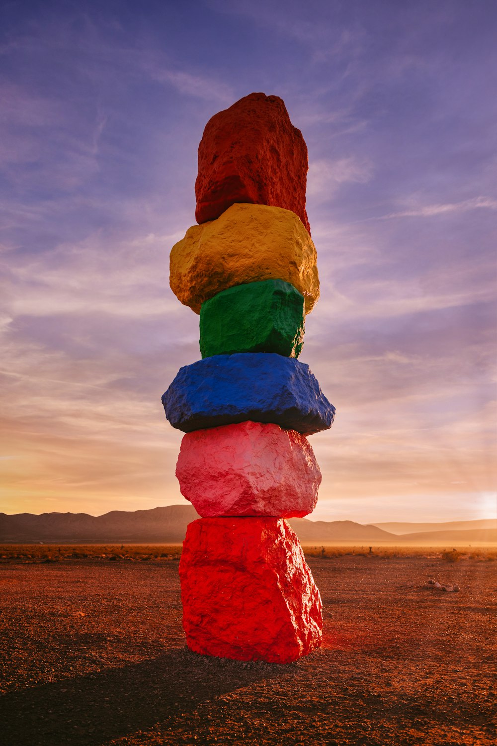 a stack of rocks sitting in the middle of a desert