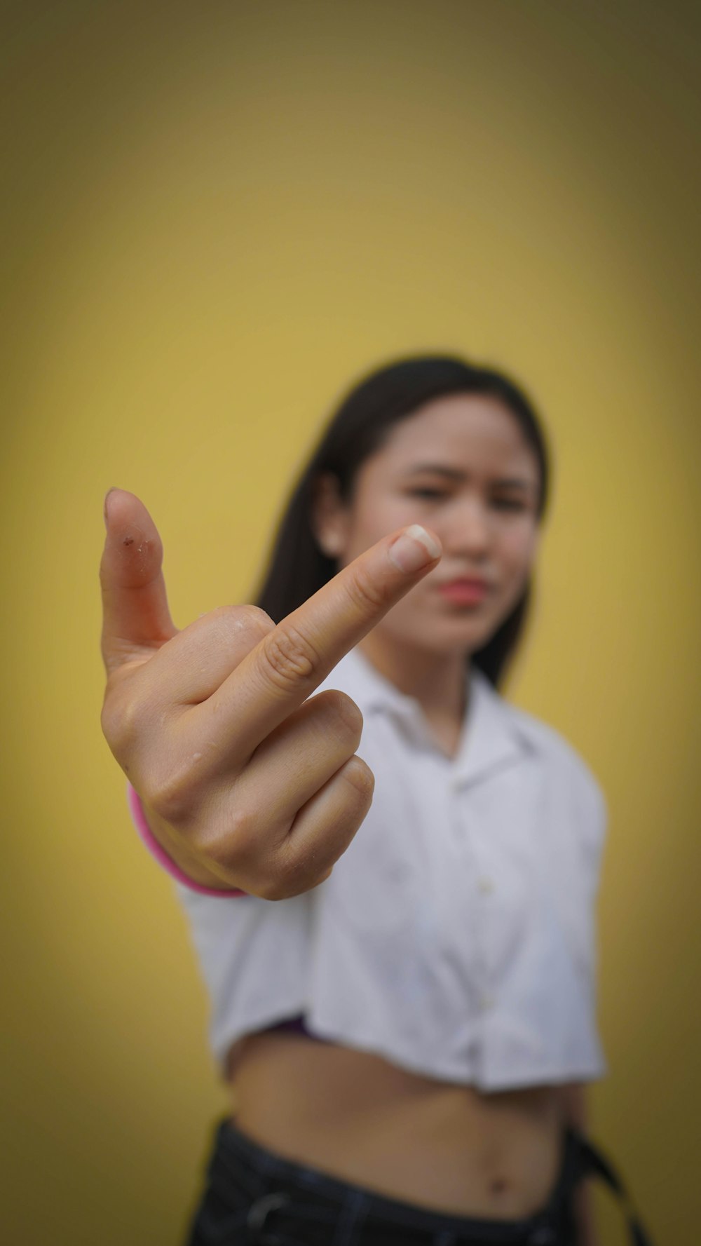 a woman pointing a finger at the camera