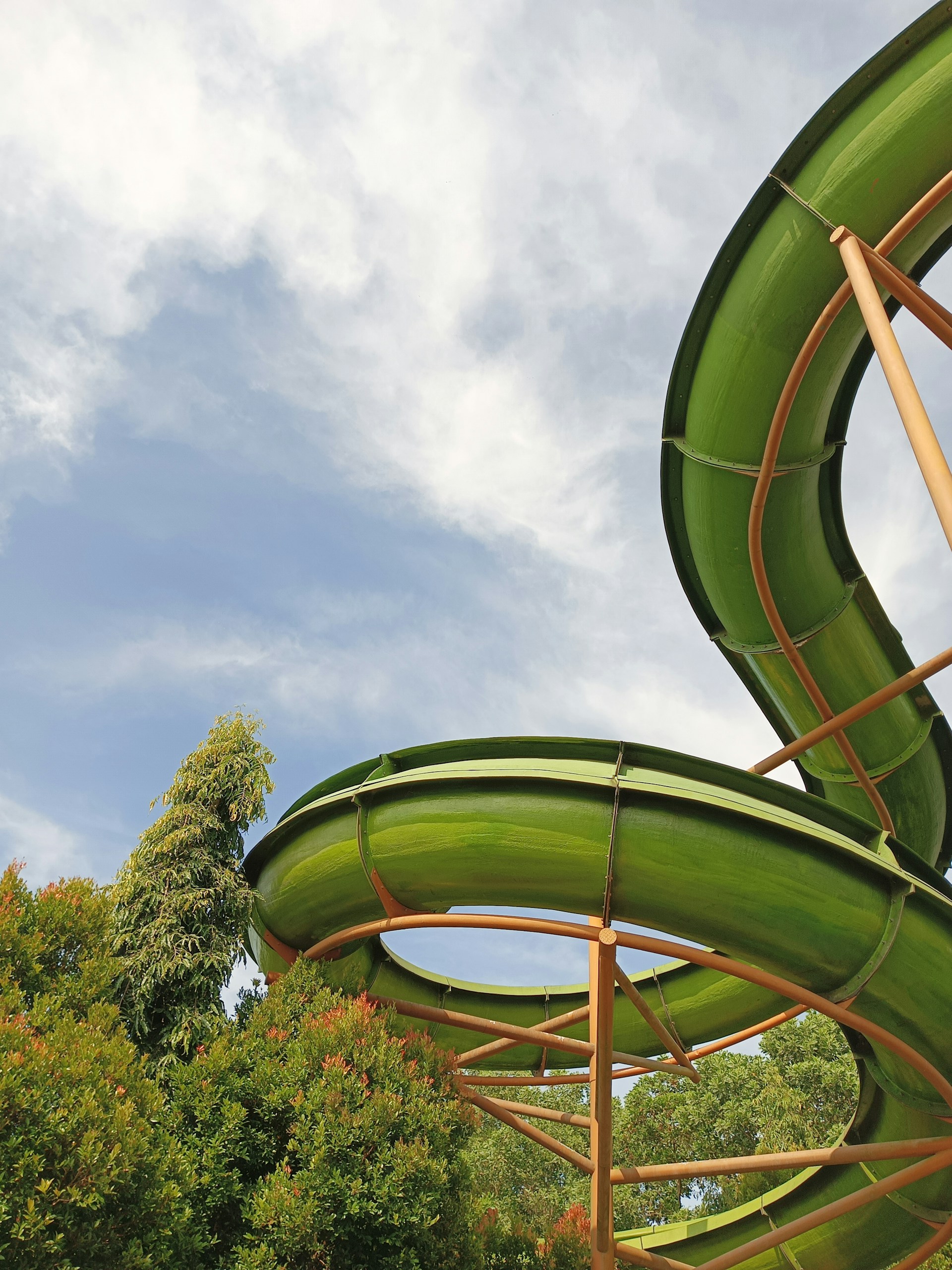 woman wearing yellow long-sleeved dress under white clouds and blue sky during daytime