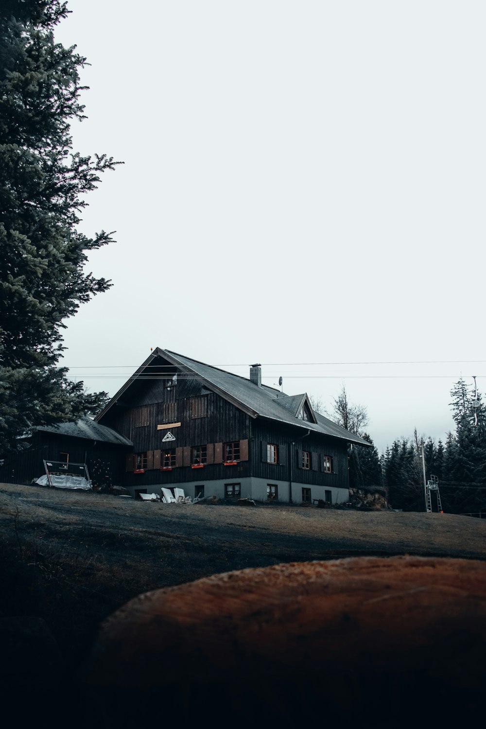 a large house sitting on top of a lush green field