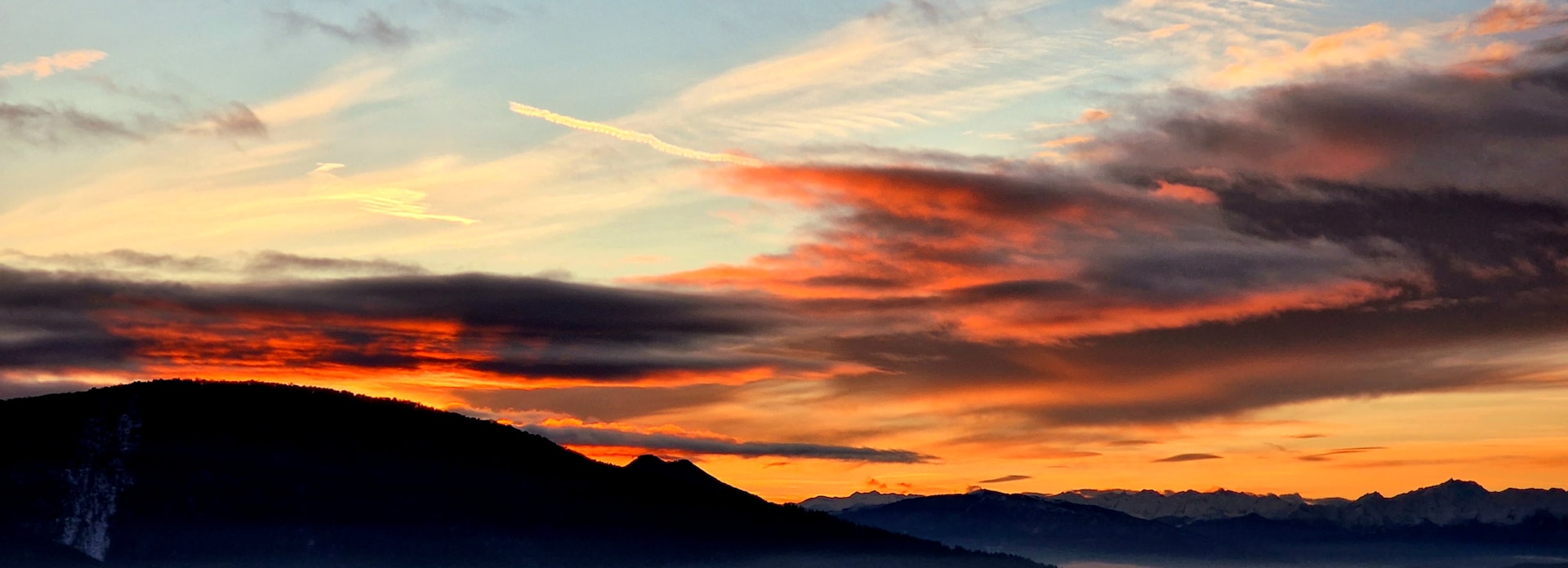 woman wearing yellow long-sleeved dress under white clouds and blue sky during daytime
