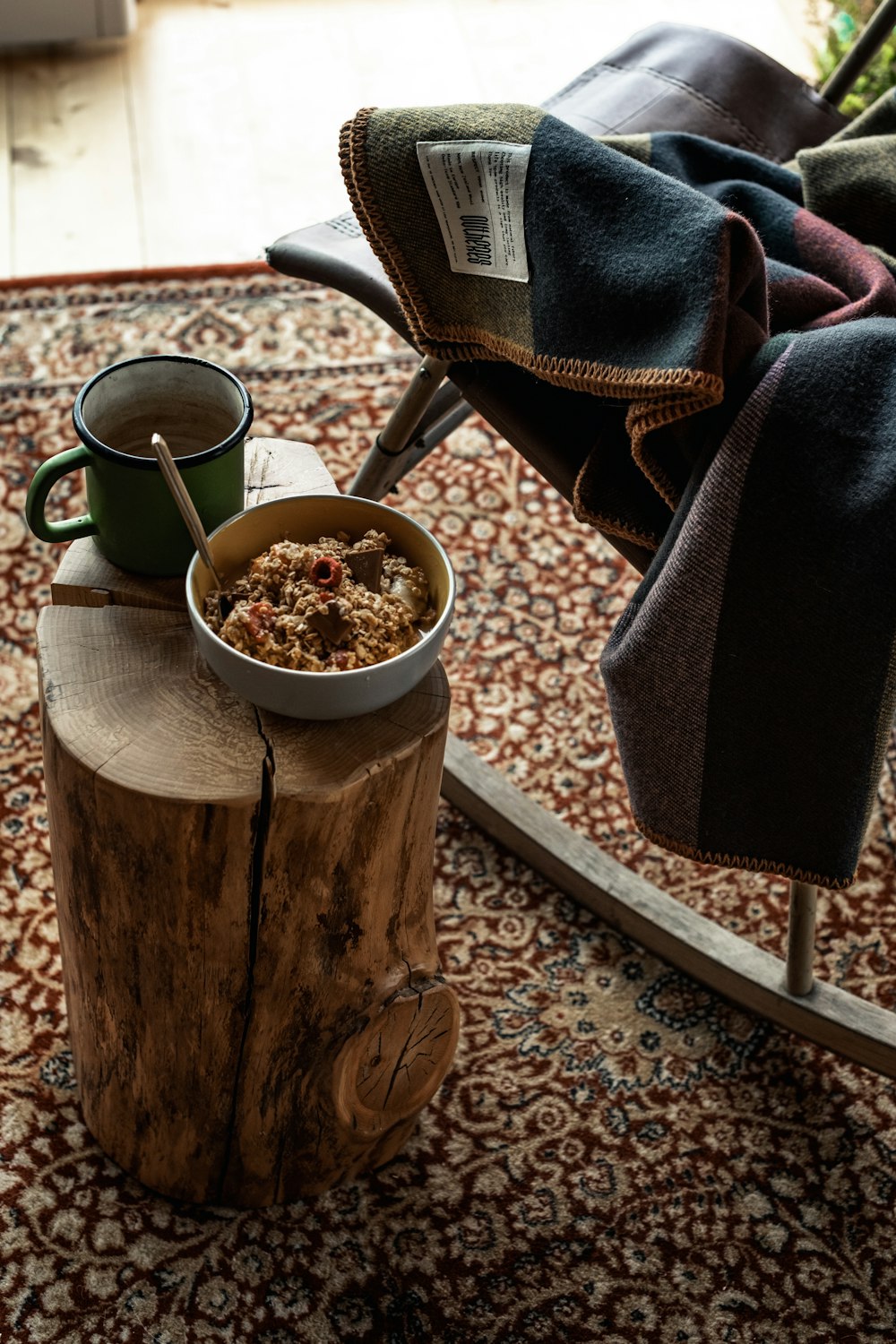 a bowl of cereal sitting on top of a wooden table