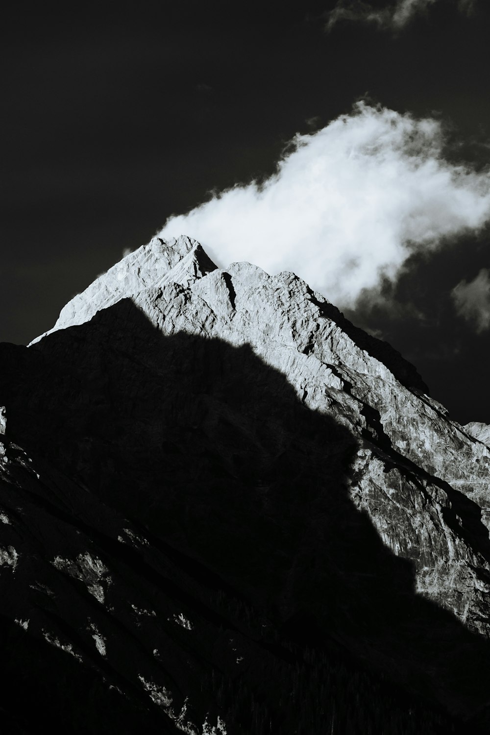 a black and white photo of the top of a mountain