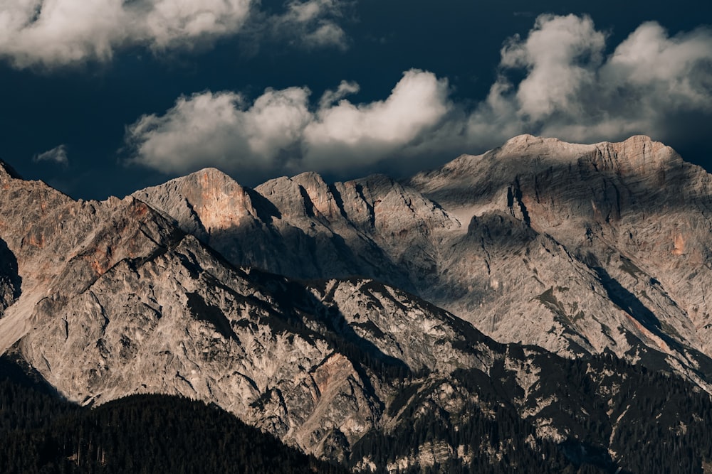 a view of a mountain range under a cloudy sky