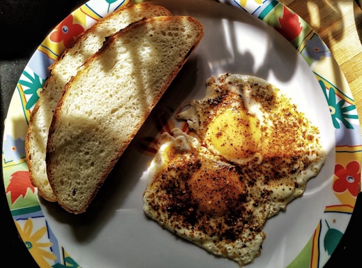 A colorful plate of Tunisian brik with golden crispy edges and a perfectly cooked egg inside.