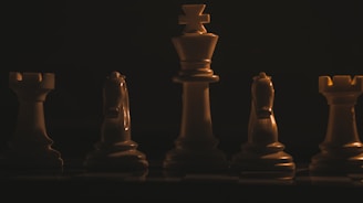 a group of chess pieces sitting on top of a chess board