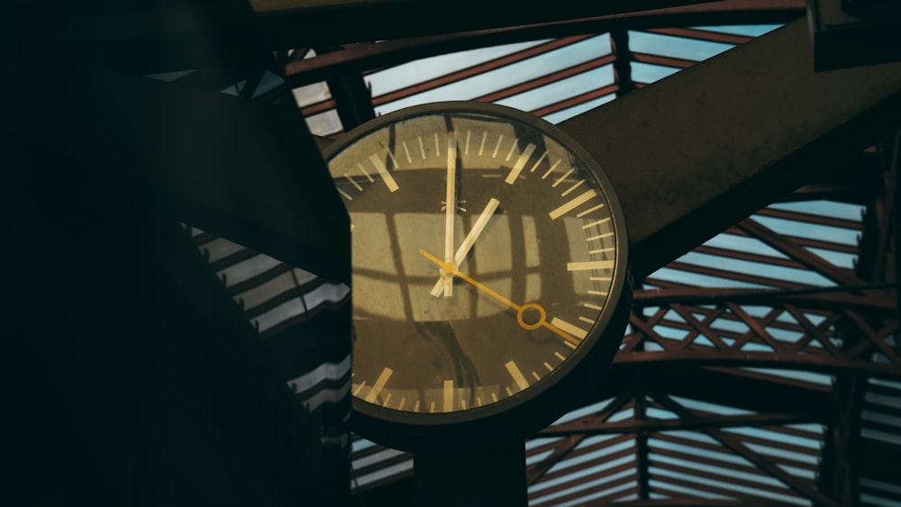 a clock hanging from the side of a building