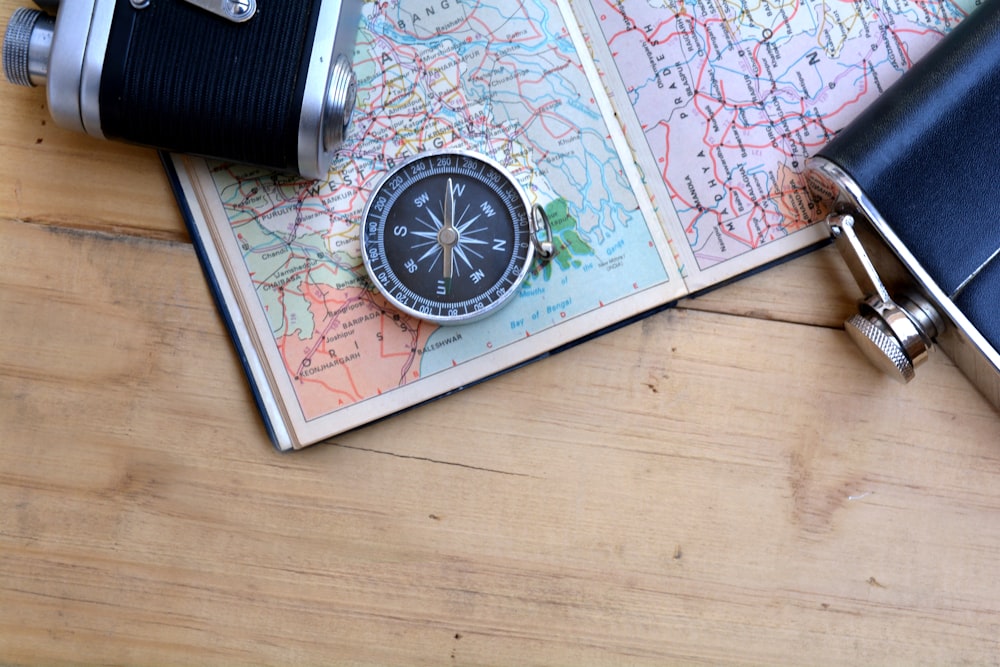 a map with a compass and a camera on it