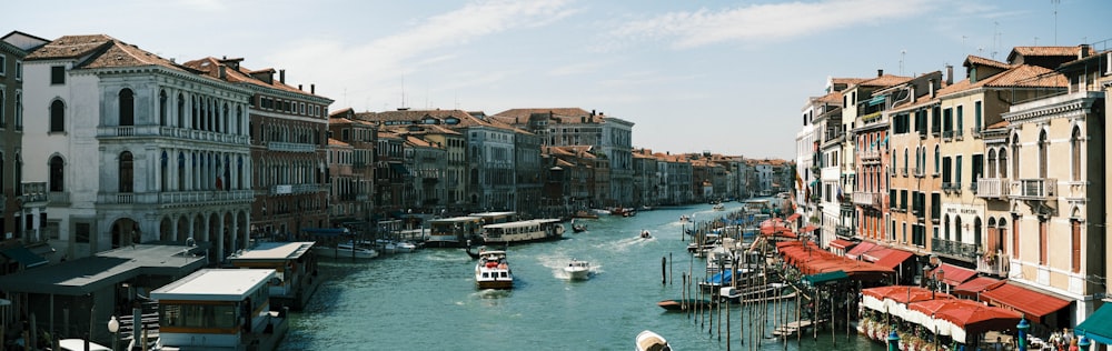 a river running through a city next to tall buildings