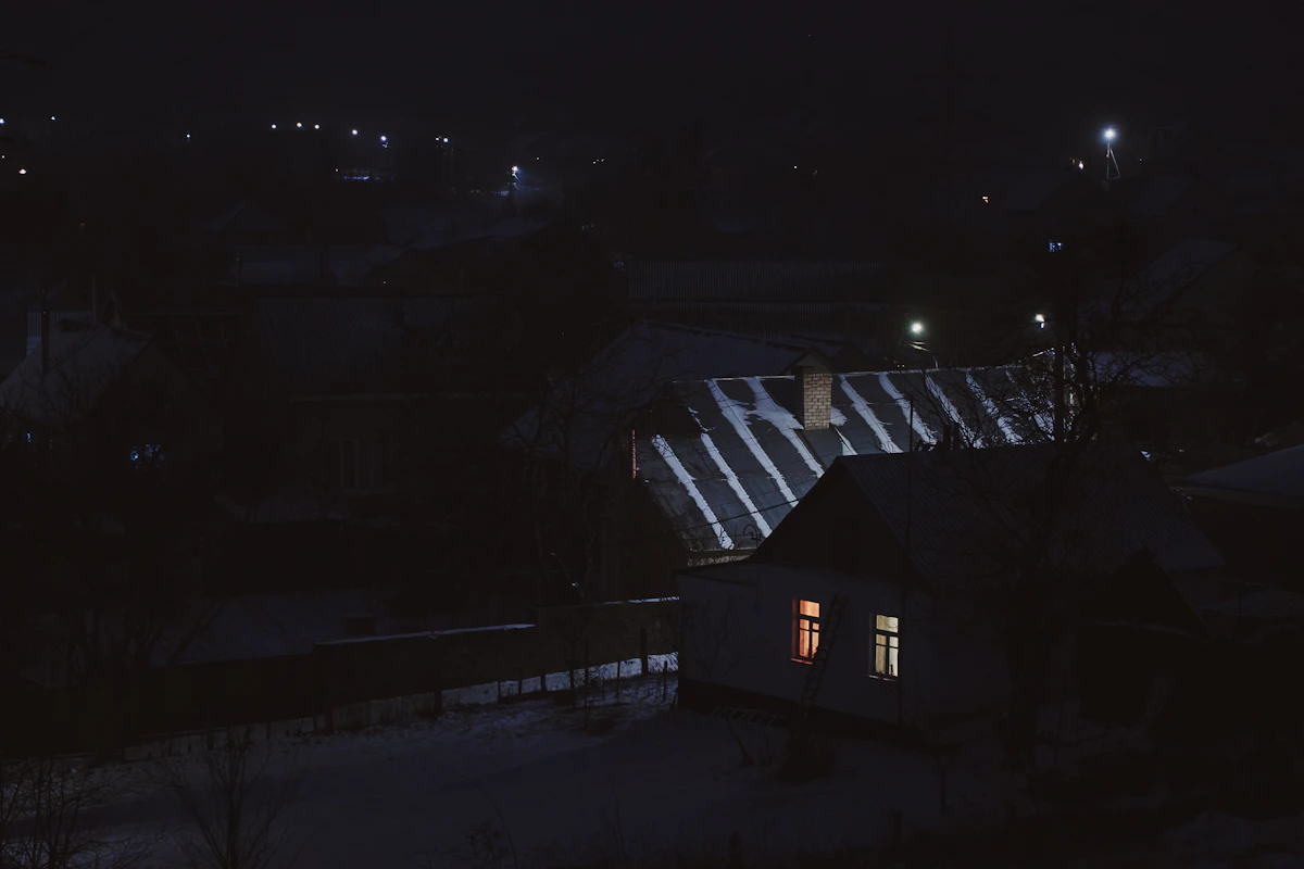 Roofline lighting on a home at night