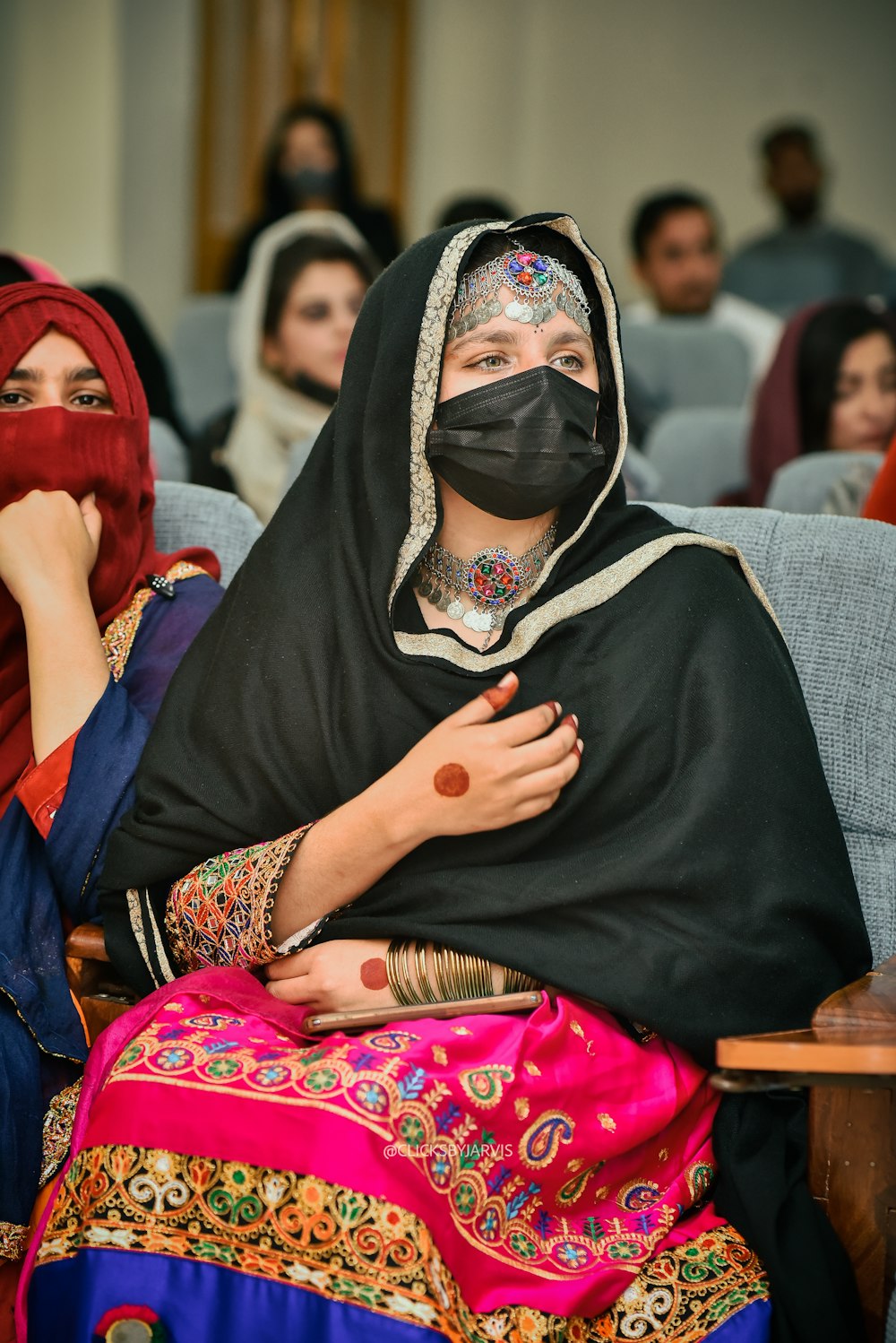 a group of women sitting next to each other