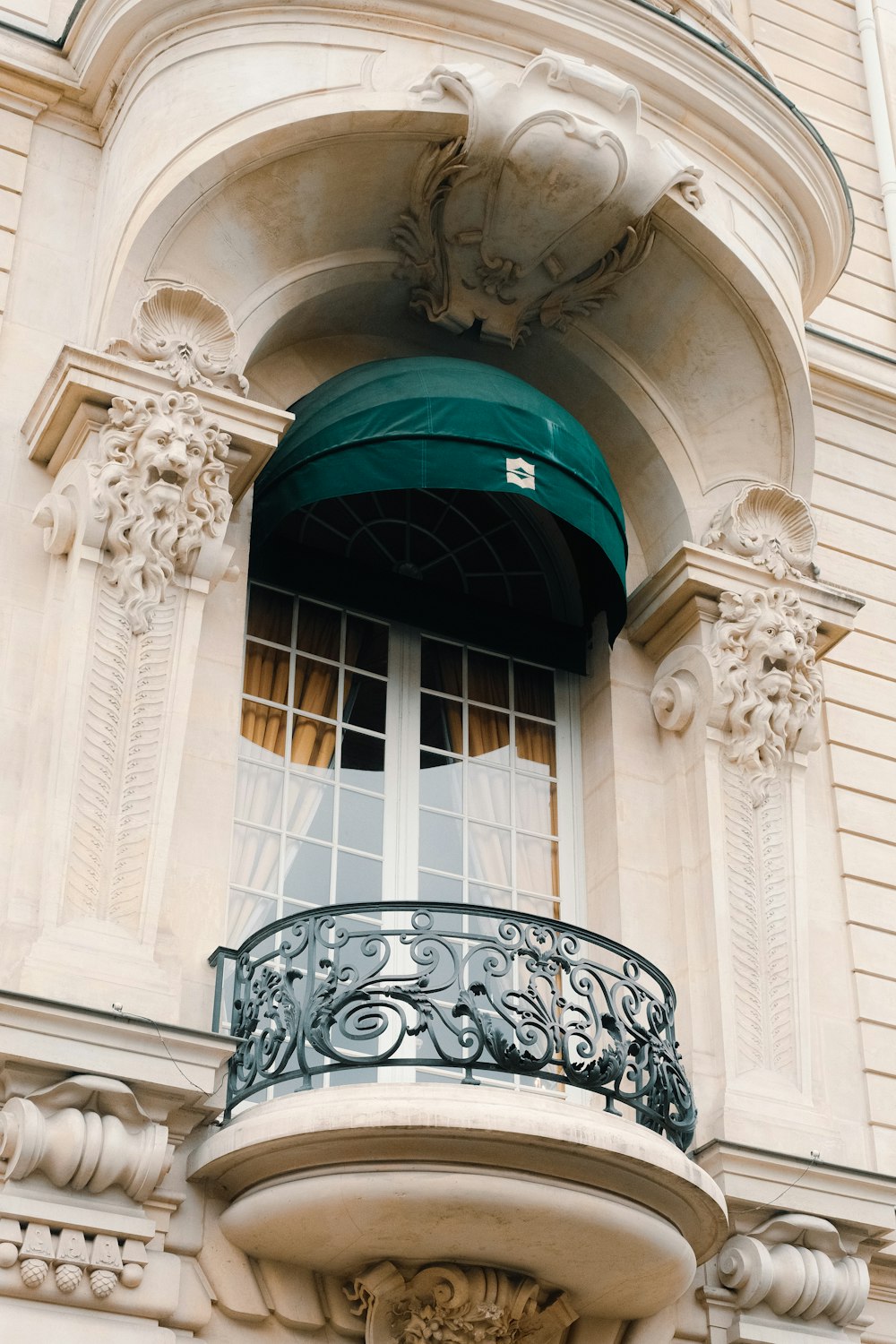 a balcony with a green awning over it