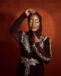 a woman in a hijab poses for a picture