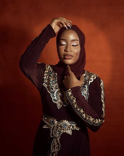 a woman in a hijab poses for a picture