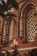 a close up of a building with a decorative window