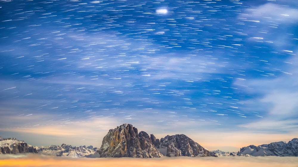 a mountain range with stars in the sky