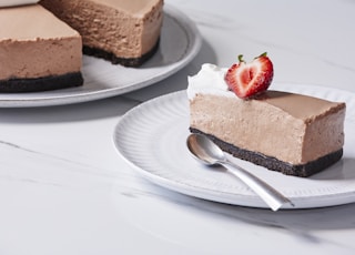 a slice of chocolate cheesecake with a strawberry on top