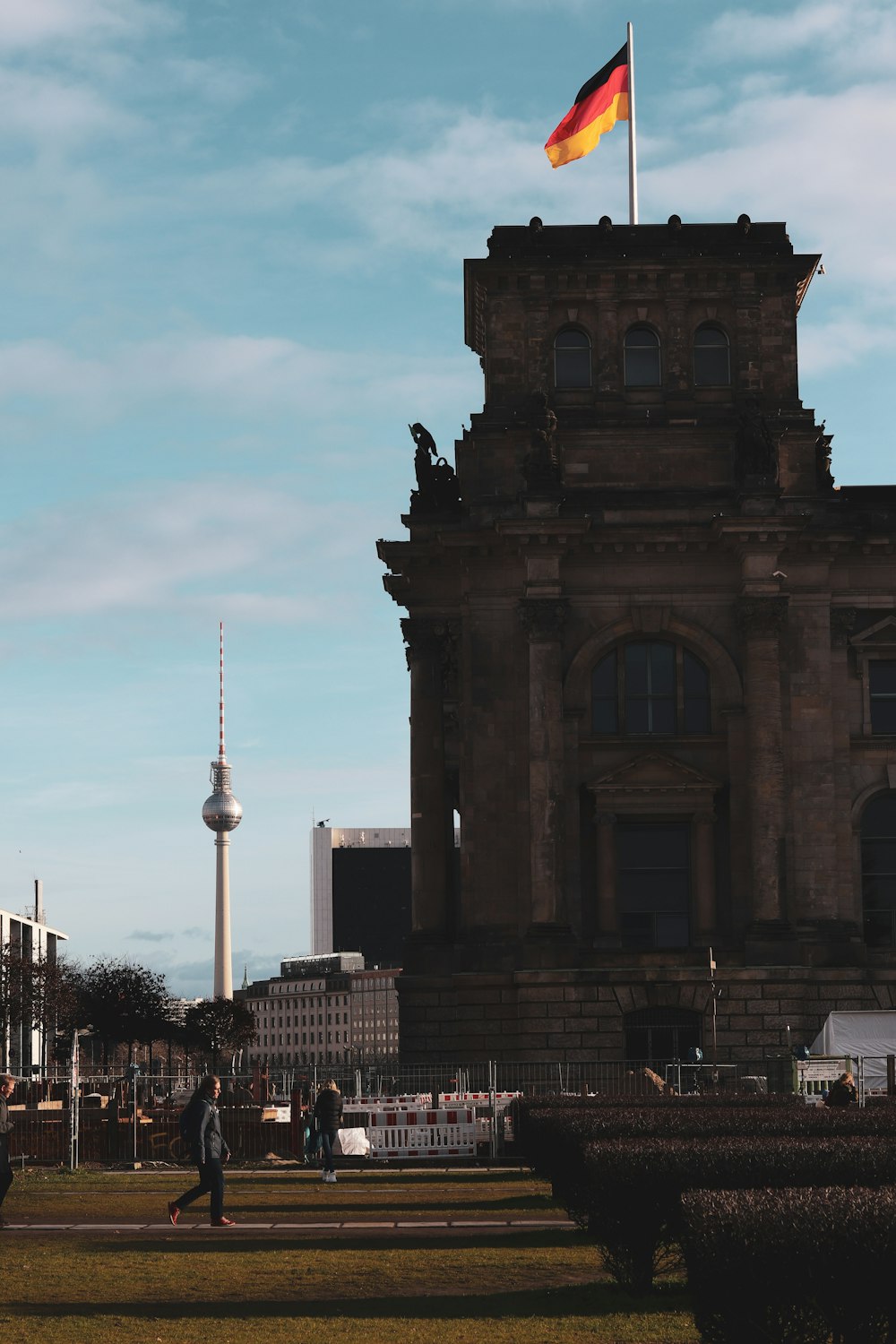 a tall building with a flag on top of it