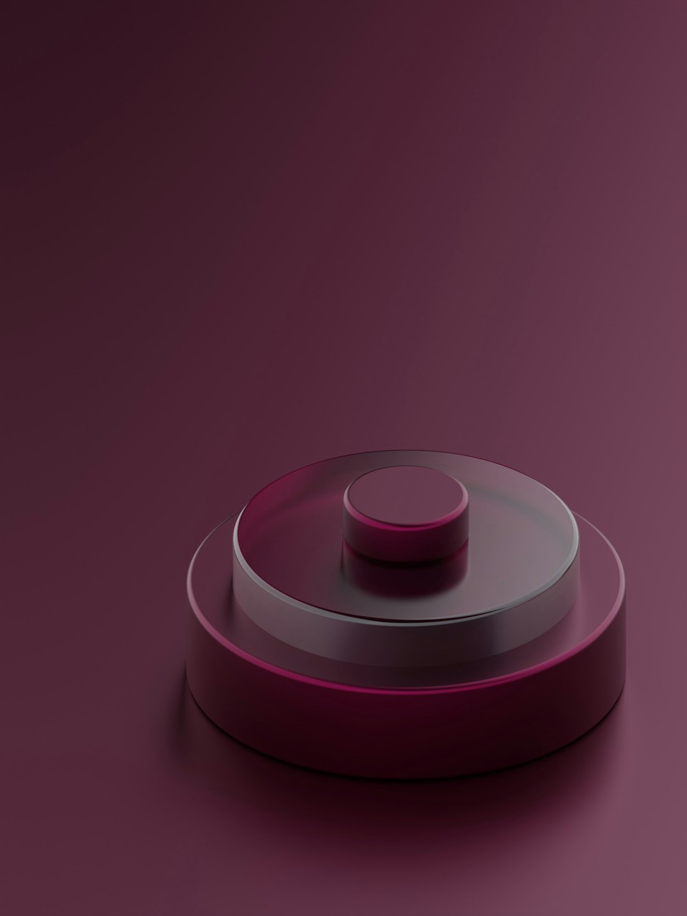 a round object with a pink base on a purple surface