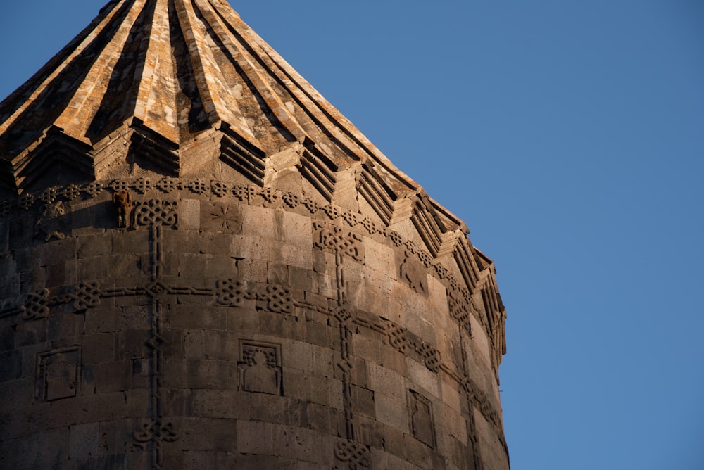 a tall tower with a clock on the top of it