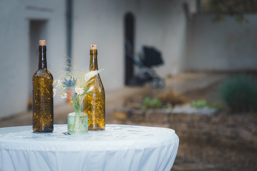 two bottles of wine sitting on top of a table