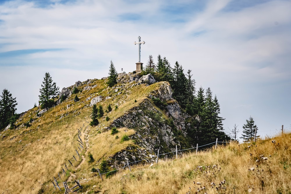 a hill with a cross on top of it