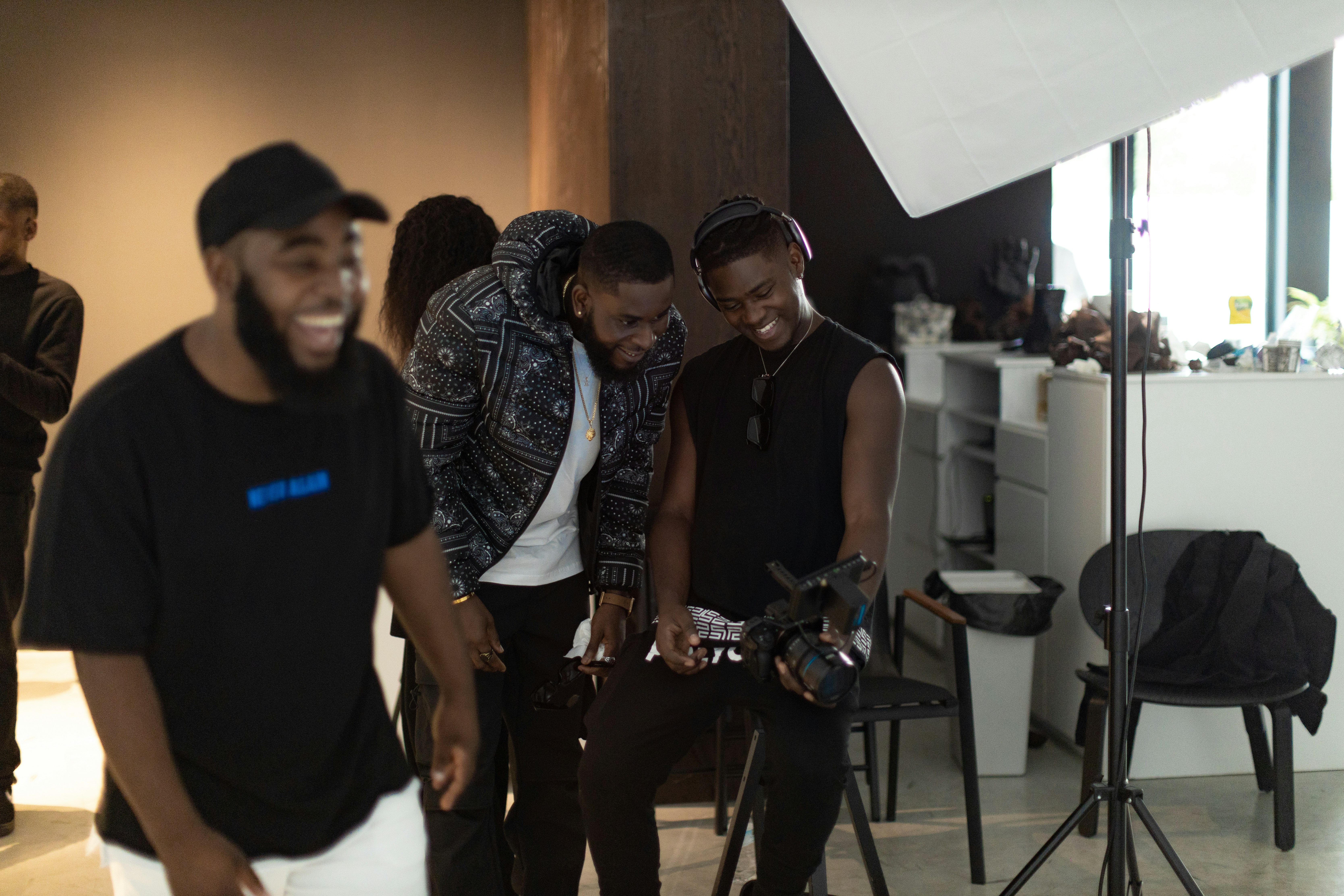 a group of people standing around each other