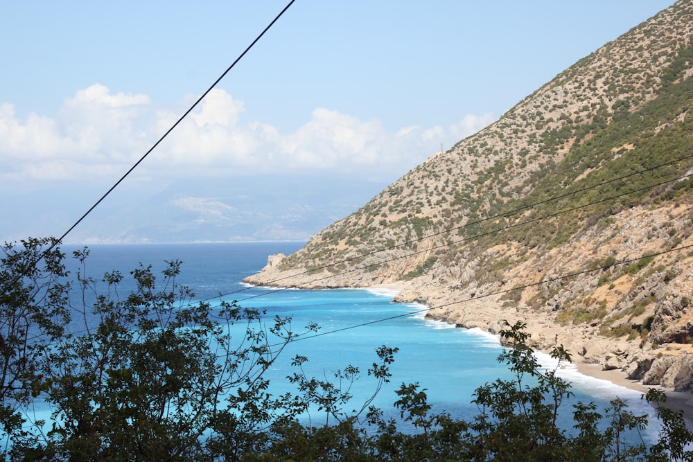 a view of the ocean from the top of a hill