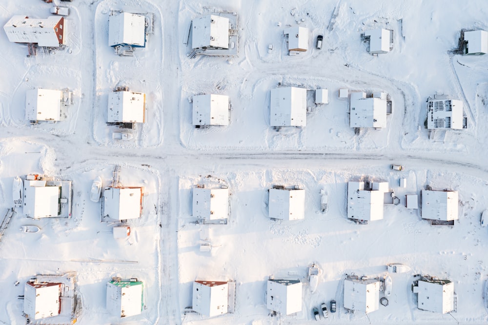 an aerial view of a snow covered parking lot