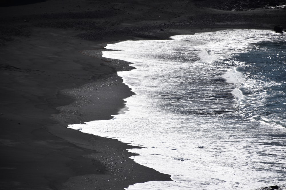 a black and white photo of the ocean