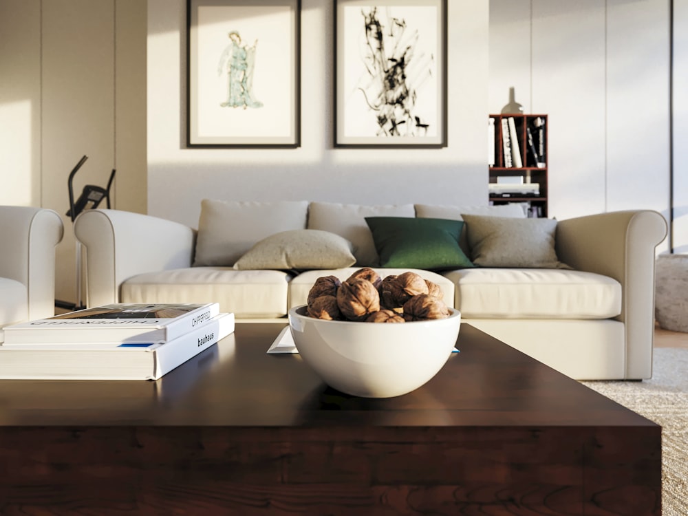 a bowl of nuts on a table in a living room