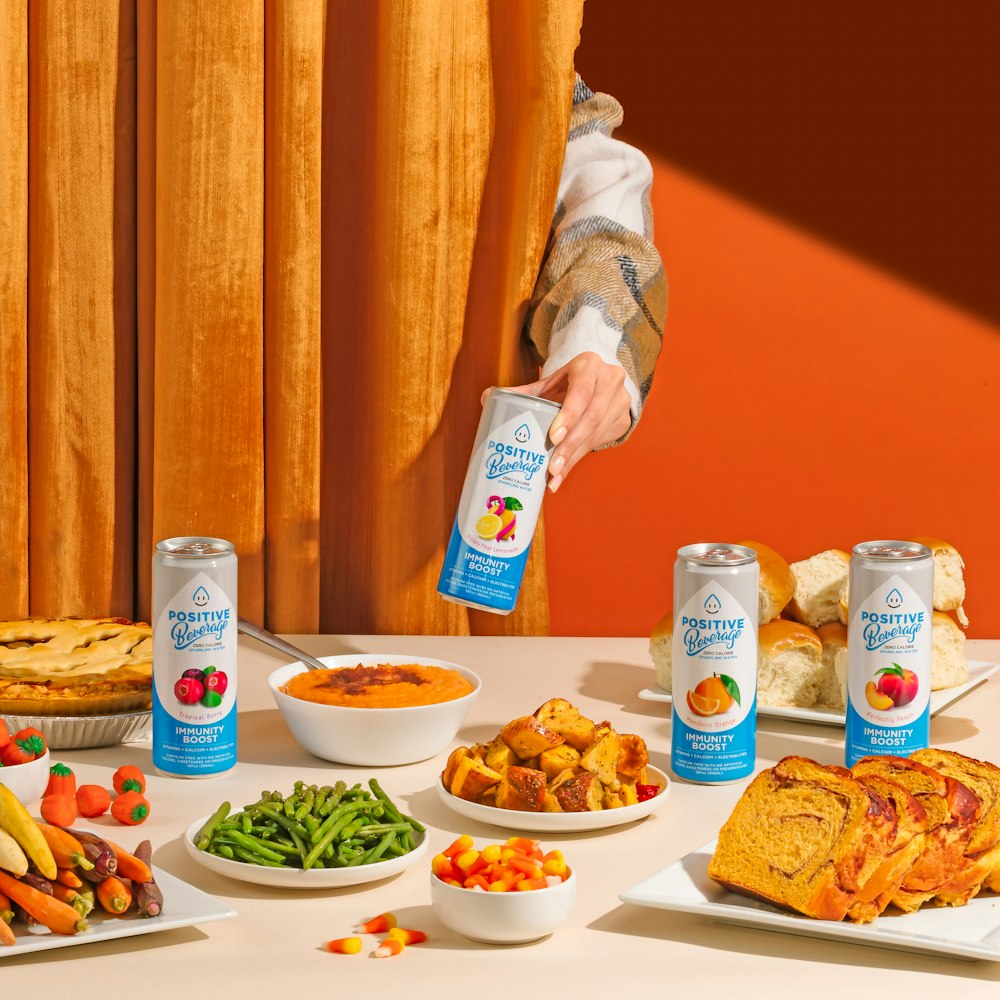 a table topped with lots of food and drinks