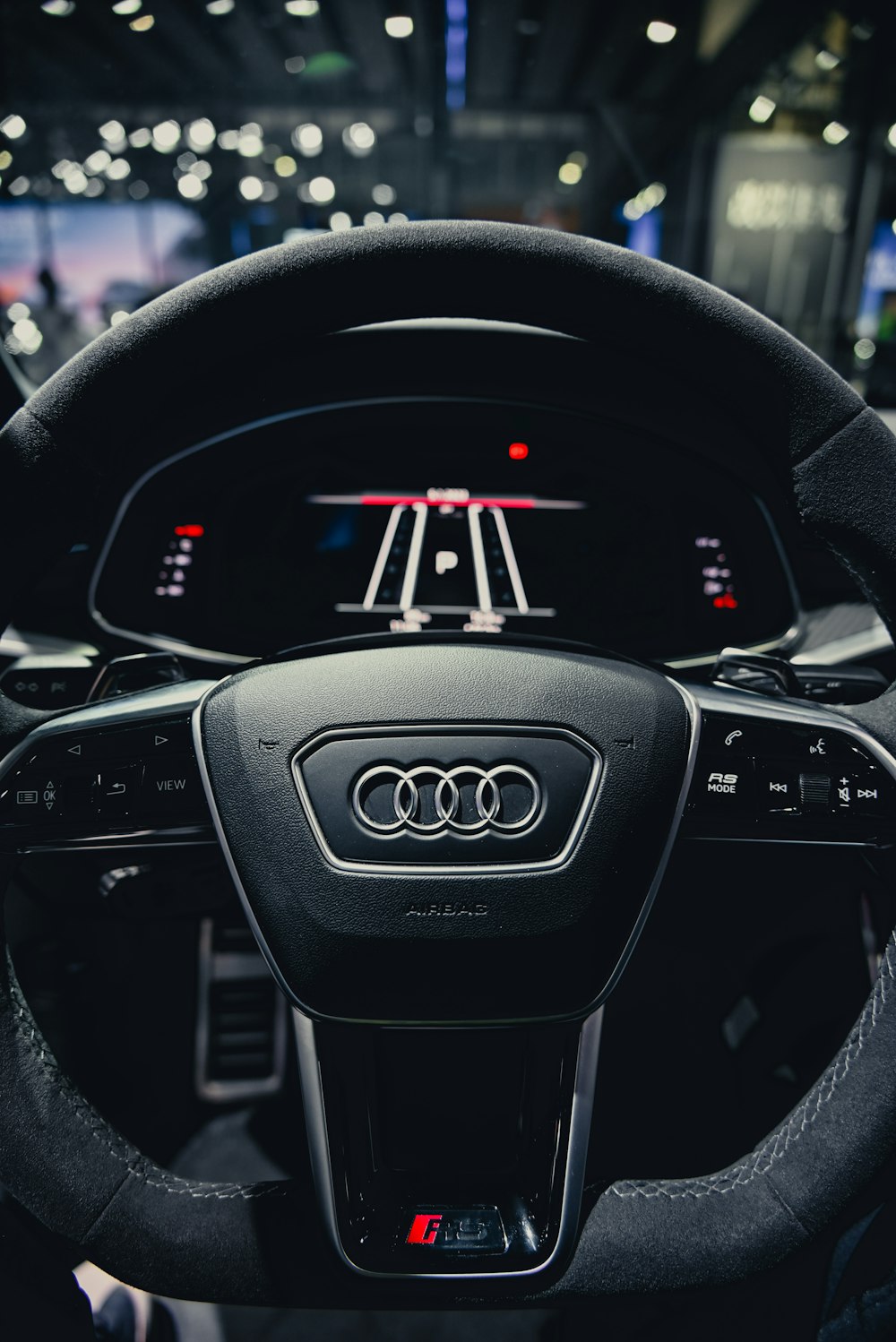 the steering wheel of a car on display at a car show