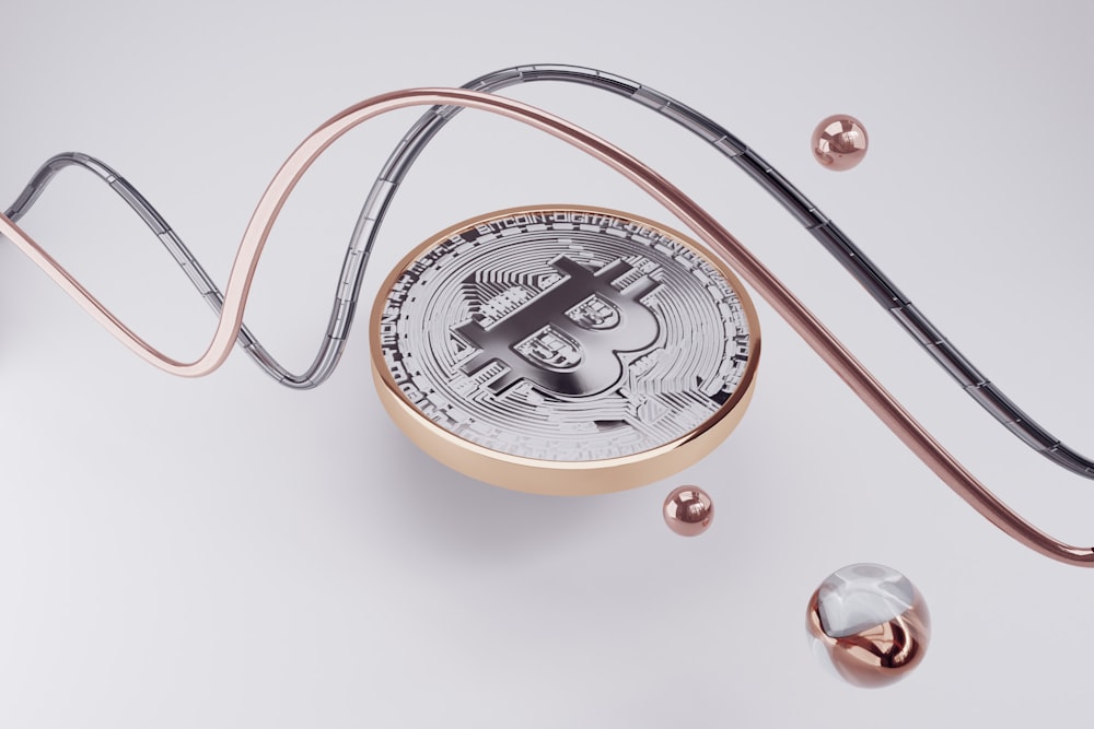 a compass with a bitcoin on top of it