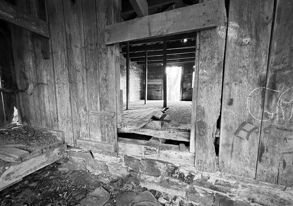 a black and white photo of a run down house