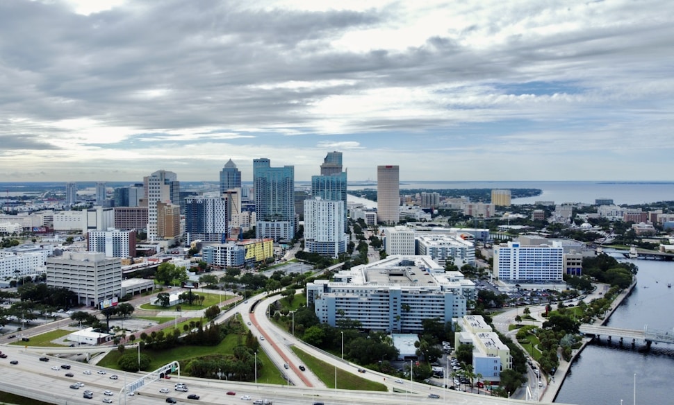 an aerial view of a city with tall buildings