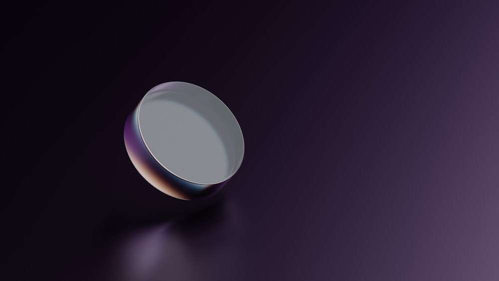 a round object is shown on a purple background
