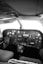 a black and white photo of the cockpit of a plane