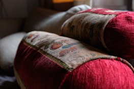 Close-up of sophisticated sofa and decorative cushions in a bright room.