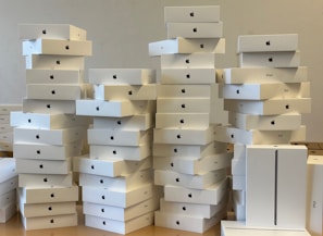An organized warehouse filled with boxes of iPhones ready for distribution.