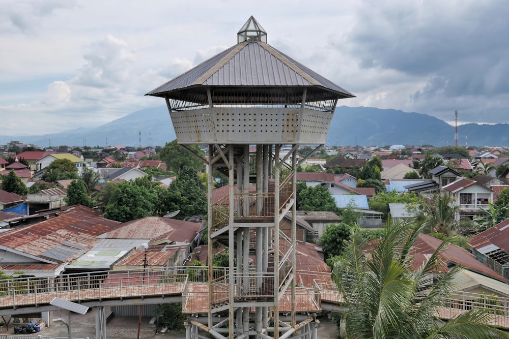 a tall tower sitting in the middle of a village