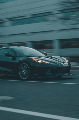 A dynamic automotive scene showcasing a sleek car in motion.