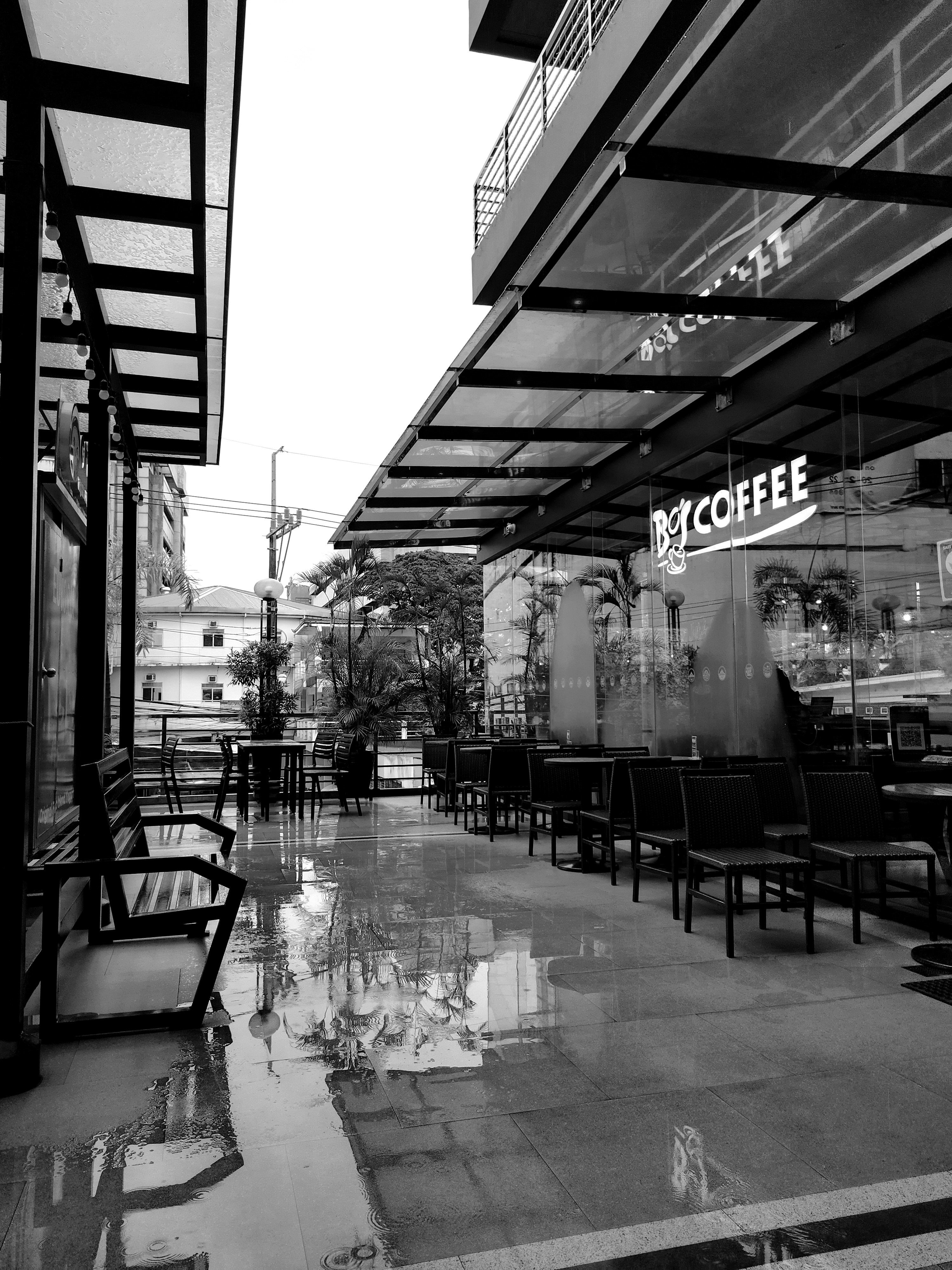a black and white photo of a coffee shop