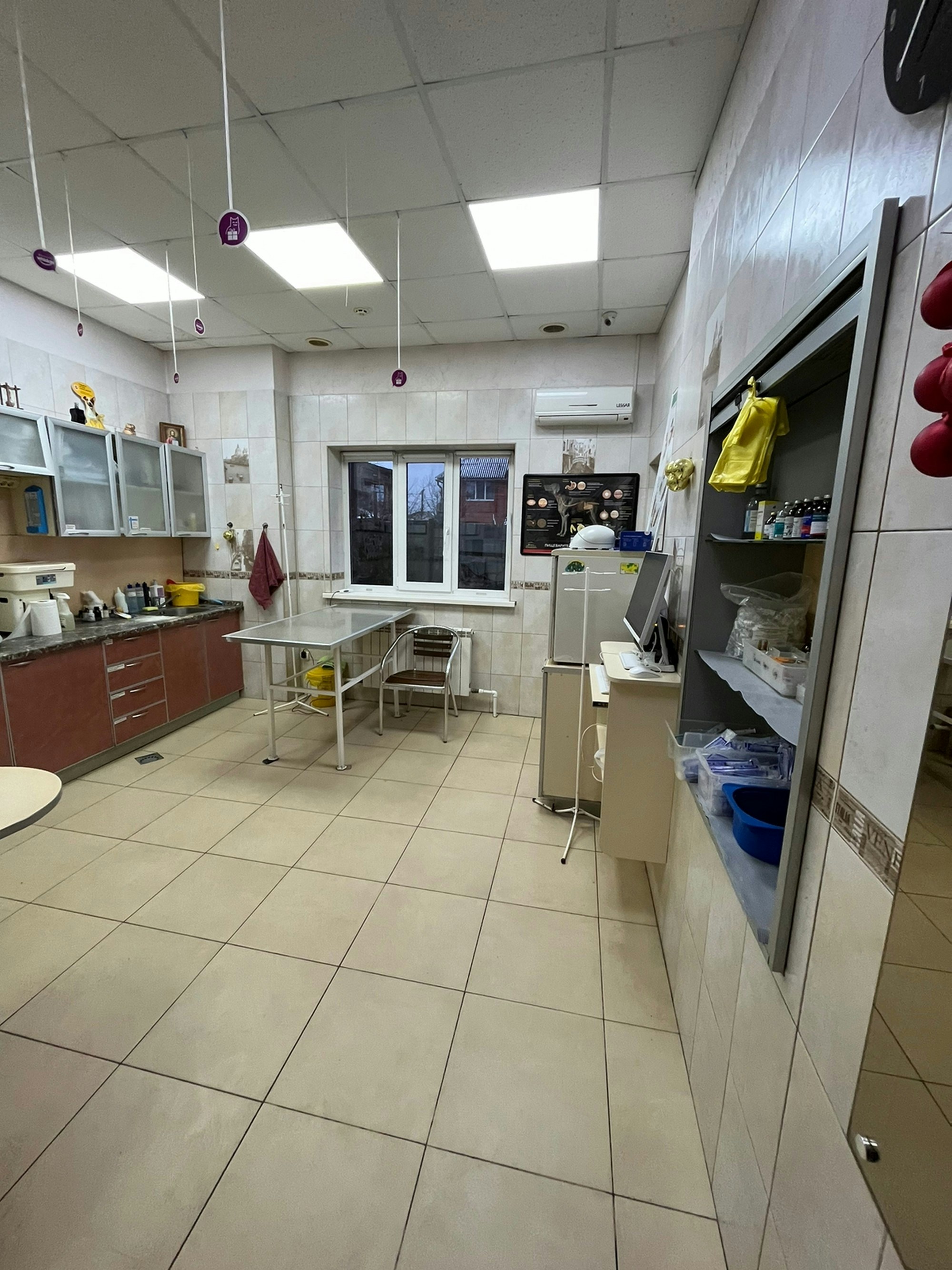 A spacious kitchen with modern appliances and bright lighting.