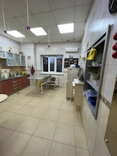 A sparkling clean kitchen with freshly mopped floors and shining countertops.