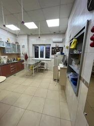 Spacious kitchen with traditional Mexican tiles and modern appliances.