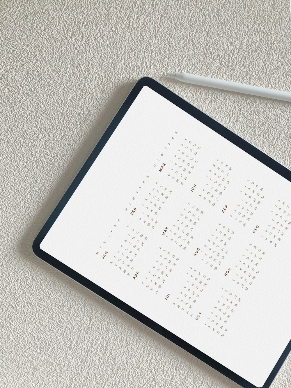 a black and white calendar sitting on top of a table