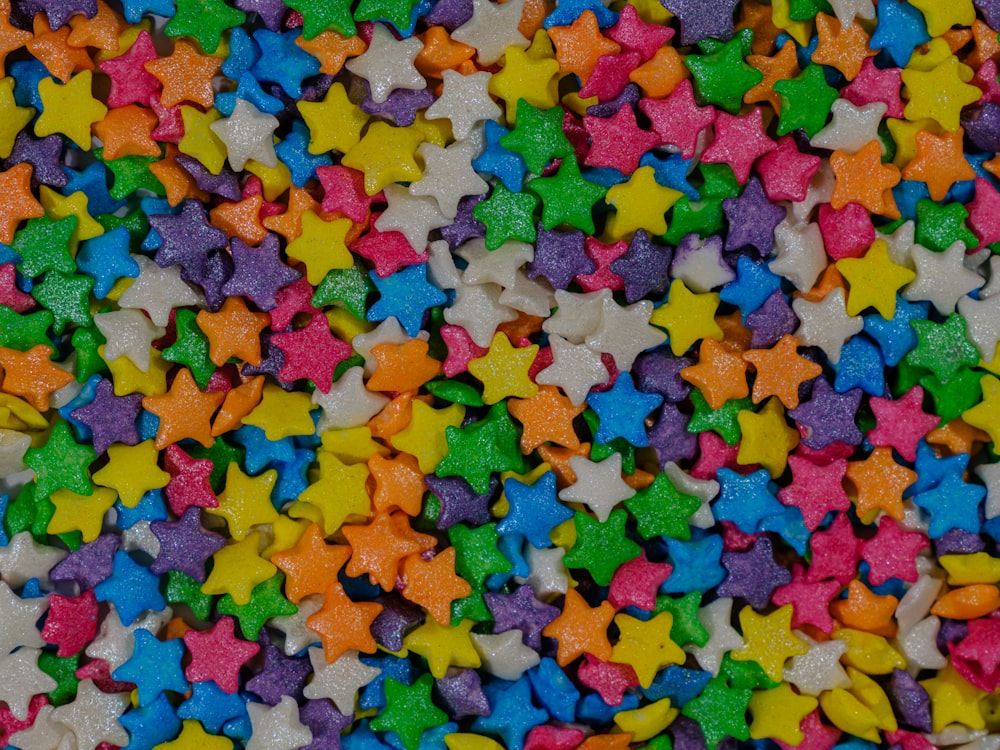 a pile of multicolored star shaped candies