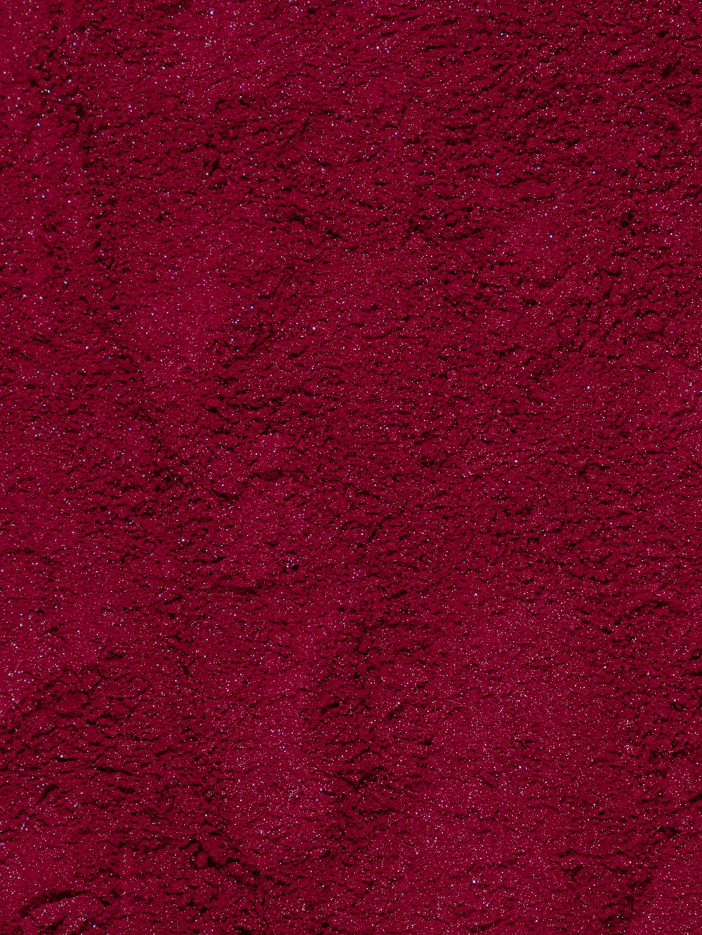 a close up of a red area rug