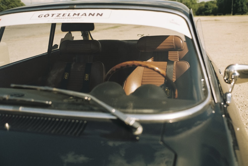 the interior of an old car with leather seats